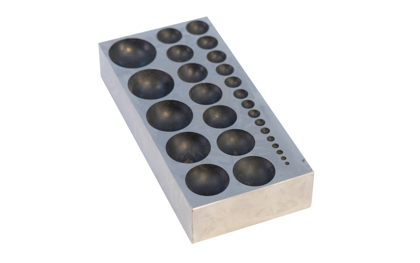 This steel dapping block with 27 round holes is ideal for use by hobbyists, jewelers, and craftsmen for shaping metals & other materials in jewelry making, metalworking, & other applications. 2-1/2" x 5-1/8" x 1" block size.