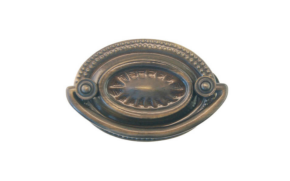 Antique Brass Oval Heppelwhite Drop Pull ~ Traditional Heppelwhite & Sheraton style - Antique Brass Finish ~ Vintage-style Hardware · Traditional & classic ~ Traditional & classic Heppelwhite & Sheraton period style ~ 2" spacing of screw holes ~ Includes an ornate stamped brass backplate ~ Traditional Heppelwhite style, but suitable for different traditional & period decors, including Victorian ~ Ornate style ~ Sunburst