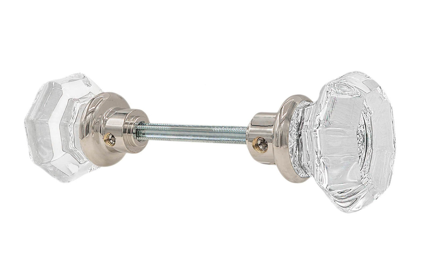 A high quality & genuine glass doorknob set with an attractive octagonal design. The sparkling center point under the glass amplifies reflected light to showcase beautiful facets. The rim of the brass base folds over the base of the glass knob for a secure grip. Polished Nickel Finish