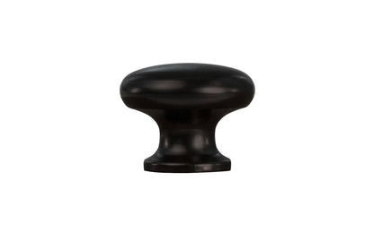 A classic & traditional small black finish cabinet knob. 3/4" diameter. The knob is made of brass material with a black finish & has a smooth & attractive look & feel. The mini "mushroom" knob is ideal for small drawers, bookcases, cubbyholes, small boxes, & other small furniture pieces & cabinets.