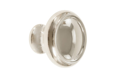 Solid Brass Dome-Style Cabinet Knob ~ 1-1/4" Diameter. Made of solid brass material. The knob is designed in the Mid-Century style of hardware, but will fit in with any time period up to the current modern styles. Great for kitchens, bathrooms, on furniture, cabinets, drawers, small doors, cabinet doors. Dome knob. Polished Nickel Finish
