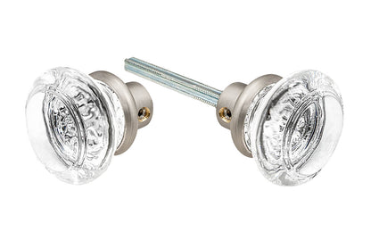 Pair of Classic Round Clear Glass Doorknobs with spindle. A high quality & genuine glass doorknob set with an attractive round design. The sparkling center point under glass amplifies reflected light to showcase beautiful facets. Solid brass base. Reproduction Glass Door Knobs. Traditional Round Glass Knobs. Brushed Nickel Finish.