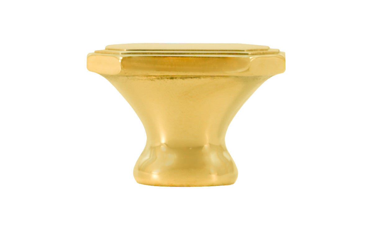 Classic "Art Deco" style cabinet knob with a retro 1930's look. It has an octagonal oblong shape with ring steps on the top. Made of high quality solid brass. Designed in the 1930's, Streamline Moderne, Art Deco style. 1-1/4" long x 7/8" wide. Unlacquered brass (will patina naturally over time). Non-lacquered brass. Un-lacquered brass.