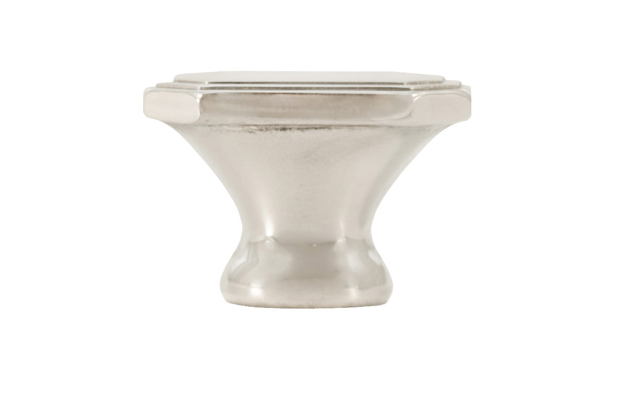 Classic "Art Deco" style cabinet knob with a retro 1930's look. It has an octagonal oblong shape with ring steps on the top. Made of high quality solid brass. Designed in the 1930's, Streamline Moderne, Art Deco style. 1-1/4" long x 7/8" wide. Polished Nickel Finish.