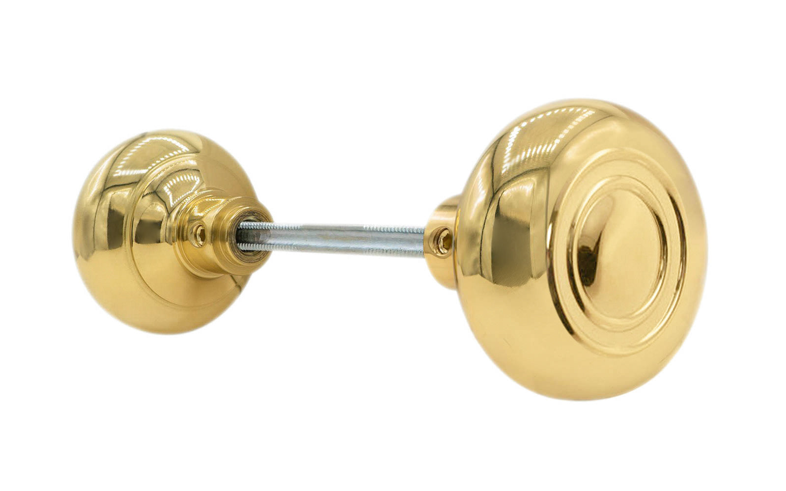 Pair of Traditional & Classic Brass Circle-Ring Design Doorknobs with spindle. Quality hollow core wrought brass doorknobs with an attractive circle-ring design. Reproduction Brass Door Knobs. Traditional Brass Knobs with Spindle. Set includes two knobs with spindle. Lacquered Brass Finish.