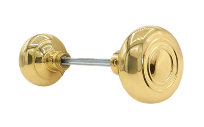Pair of Traditional & Classic Brass Circle-Ring Design Doorknobs with spindle. Quality hollow core wrought brass doorknobs with an attractive circle-ring design. Reproduction Brass Door Knobs. Traditional Brass Knobs with Spindle. Set includes two knobs with spindle. Lacquered Brass Finish.