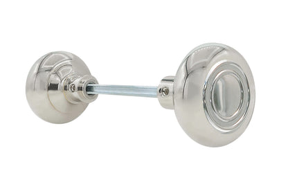 Pair of Traditional & Classic Brass Circle-Ring Design Doorknobs with spindle. Quality hollow core wrought brass doorknobs with an attractive circle-ring design. Reproduction Brass Door Knobs. Traditional Brass Knobs with Spindle. Set includes two knobs with spindle.  Polished Nickel Finish.