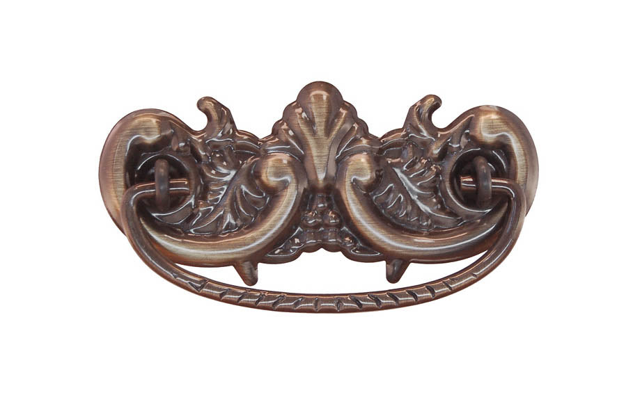 Brass Victorian Drop Pull ~ 3" On Centers - Antique Brass Finish ~ Vintage-style Hardware · Traditional & classic ~ Made of high quality solid brass material ~ 3" spacing of screw holes ~ Includes an ornate stamped brass backplate ~ Designed in a traditional Victorian style, but suitable for different traditional & period decors ~ Ornate style