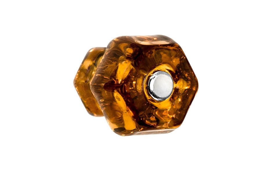 Vintage-style Hardware · Classic & original-style hexagonal glass cabinet knob with a silver pan head thru-bolt. Made of genuine glass. Amber color glass. Includes a silver pan thru-bolt. Reproduction hexagonal classic glass knob. Traditional hex glass knob. 1-1/4" Diameter Knob.