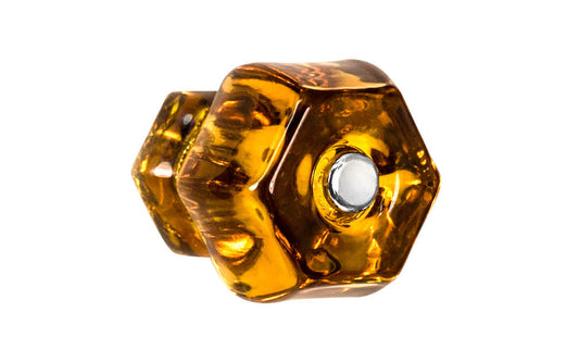 Vintage-style Hardware · Classic & original-style hexagonal glass cabinet knob with a silver pan head thru-bolt. Made of genuine glass. Amber color glass. Includes a silver pan thru-bolt. Reproduction hexagonal classic glass knob. Traditional hex glass knob. 1-1/2" Diameter Knob.