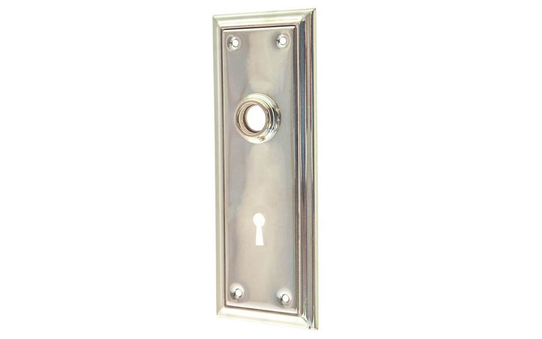 Brass Escutcheon Door Plate with Keyhole ~ Polished Nickel Finish ~ Vintage-style Hardware · Classic & traditional design ~ Quality stamped brass material ~ 6-7/8" high x 2-1/2" wide ~ For solid or pre-bored (2-1/8") hole doors