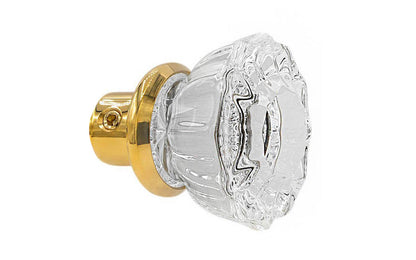 Single Classic Fluted Clear Glass Doorknob. A high quality & genuine glass doorknob with an attractive fluted design. The sparkling center point under glass amplifies reflected light to showcase beautiful facets. Solid brass base. Reproduction Glass Door Knobs. Traditional Fluted Glass Knobs. One knob. Unlacquered brass (will patina naturally), Non-Lacquered Brass.