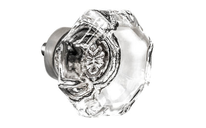 Elegant & classic octagonal cabinet glass knob with attractive genuine clear glass. The glass is carefully set into a handsome solid brass base with a threaded shank in the back. Brushed nickel finish on solid brass base. Octagon shape knob. 1-1/2" Diameter Knob 