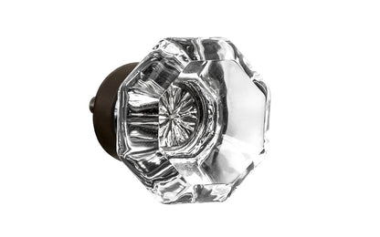Elegant & classic octagonal cabinet glass knob with attractive genuine clear glass. The glass is carefully set into a handsome solid brass base with a threaded shank in the back. Oil Rubbed Bronze Finish on solid brass base. Octagon shape knob. 1-1/4" Diameter Knob 