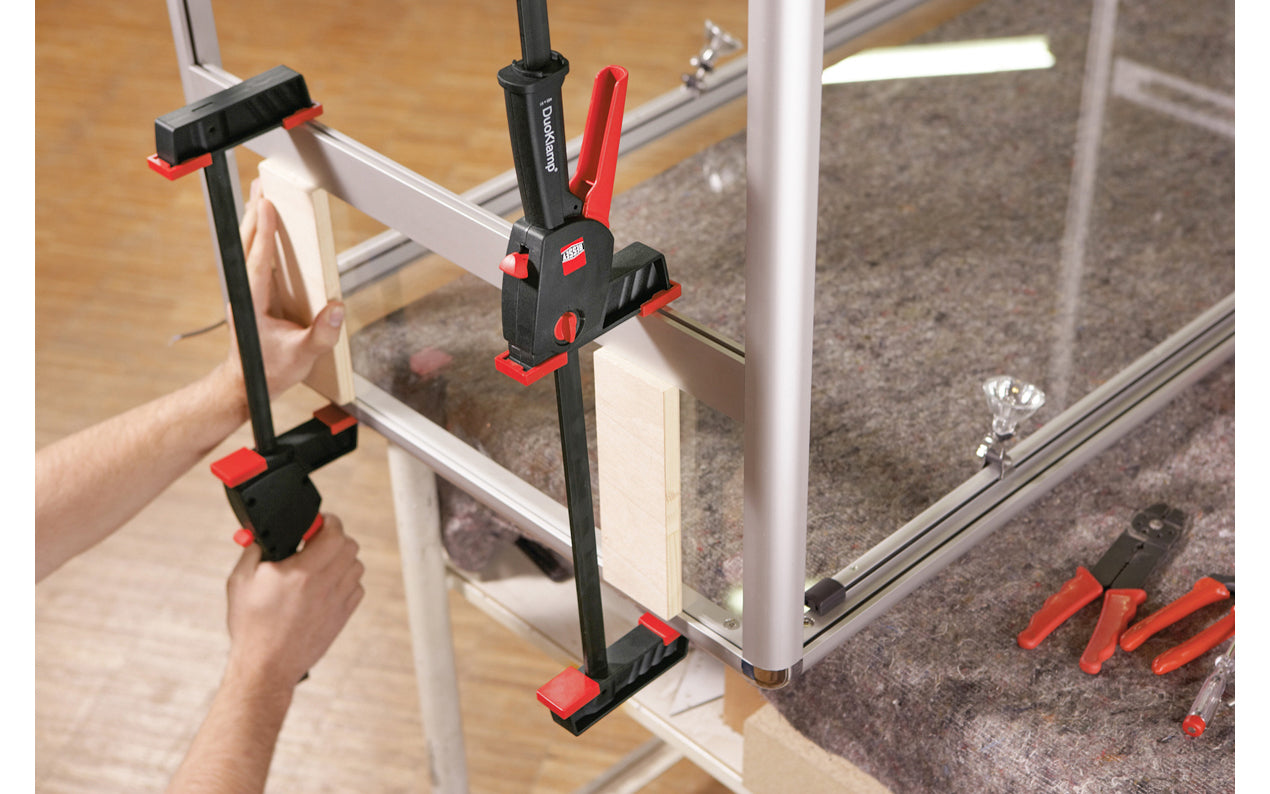Bessey 18" DuoKlamp Clamp ~ DUO45-8 - One handed clamp & spreader. Clamp or spread with the turn of a button, no tools necessary. 18" max opening & 3-1/4" deep throat. Jaws resist flex & withstand up to 260 lb. of clamping force. Soft pressure caps prevent marring of wood by distributing pressure over a greater area.  