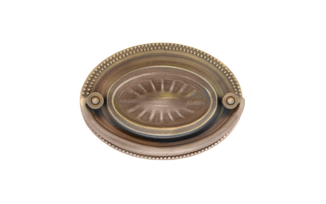 Brass Oval Heppelwhite Drop Pull ~ 3" On Centers. Antique Brass Finish ~ Vintage-style Hardware · Traditional & classic ~ Heppelwhite & Sheraton period style ~ 3" spacing of screw holes ~ Includes an ornate stamped brass backplate ~ Traditional Heppelwhite style, but suitable for different traditional & period decors, including Victorian ~ Ornate style ~ Sunburst 