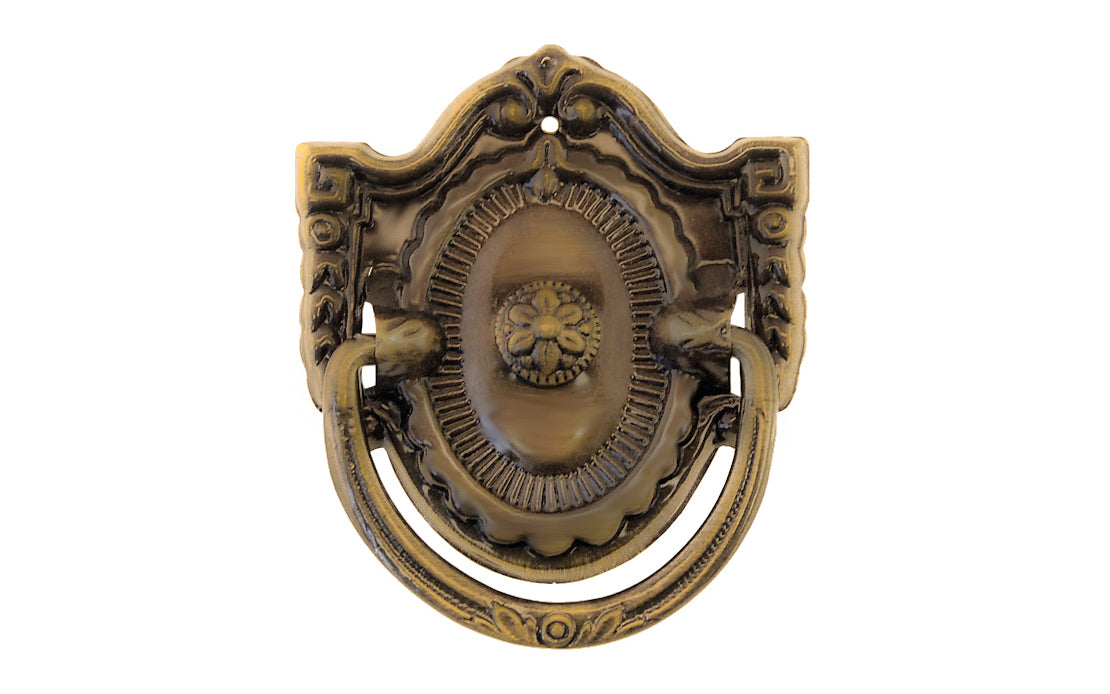 Vintage-style Traditional Hardware · Stamped brass drop pull in the Colonial Revival style. Made of stamped brass material with a nice detailed design of a "flower" at its center. Timeline: Early 20th Century, Colonial Revival, Depression Era, Waterfall style. Antique brass finish