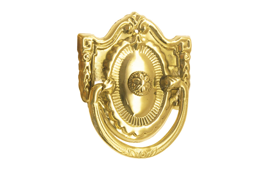 Vintage-style Traditional Hardware · Stamped brass drop pull in the Colonial Revival style. Made of stamped brass material with a nice detailed design of a "flower" at its center. Timeline: Early 20th Century, Colonial Revival, Depression Era, Waterfall style. Unlacquered brass. Non-lacquered brass