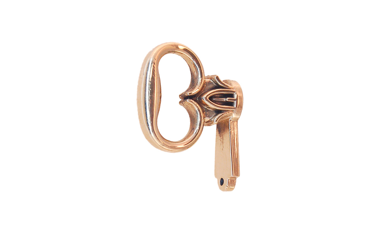 Solid Brass Mock Key for Cabinet Doors. Commonly used on Colonial Revival secretaires, highboys, China cabinets, etc. Non-lacquered brass cabinet pull. Bow 1-1/8" wide, 1" projection