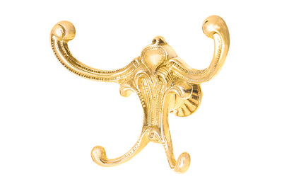 Vintage-style Victorian Unlacquered Brass Four-Prong Hook. Great for use in hallways, furniture, hall trees, bedrooms, & many other places. The hook is made of solid brass material, great for heavy coats & clothing. Four hooks. Designed in the Victorian, Late 19th Century, American Oak, Golden Oak style hardware.