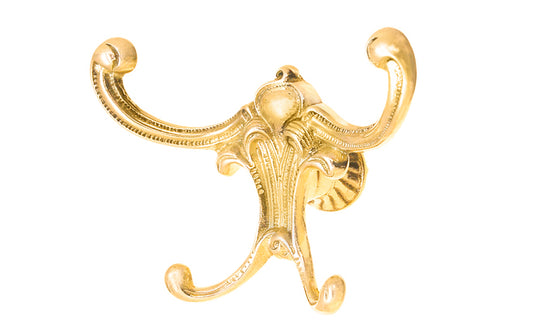 Vintage-style Victorian Unlacquered Brass Four-Prong Hook. Great for use in hallways, furniture, hall trees, bedrooms, & many other places. The hook is made of solid brass material, great for heavy coats & clothing. Four hooks. Designed in the Victorian, Late 19th Century, American Oak, Golden Oak style hardware.