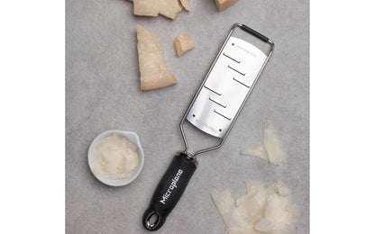 Made in USA - Blade made in USA - Great for shaving hard cheese, cucumber, chocolate, garlic, ginger - Non-slip grip - Dishwasher safe - Razor-sharp blades made from stainless steel - 18/8 grade - Ergonomic handle ~ No-slip base - Microplane Gourmet Series - Gourmet Shaver Grater - Model 45006 - Microplane Large Shaver - 098399450063