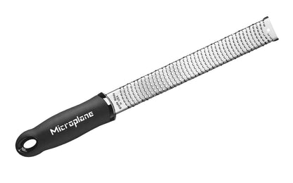 Made in USA - Blade made in USA - Great for grating hard cheeses & Citrus - Non-slip grip - Dishwasher safe - Sharp blades made from stainless steel - 18/8 grade - Ergonomic handle ~ No-slip base - Lemon Zester - Lime Zester - Microplane Fine Zester - Fine Grating - Microplane Premium Zester - Parmesan Reggiano Grater - Model 46020