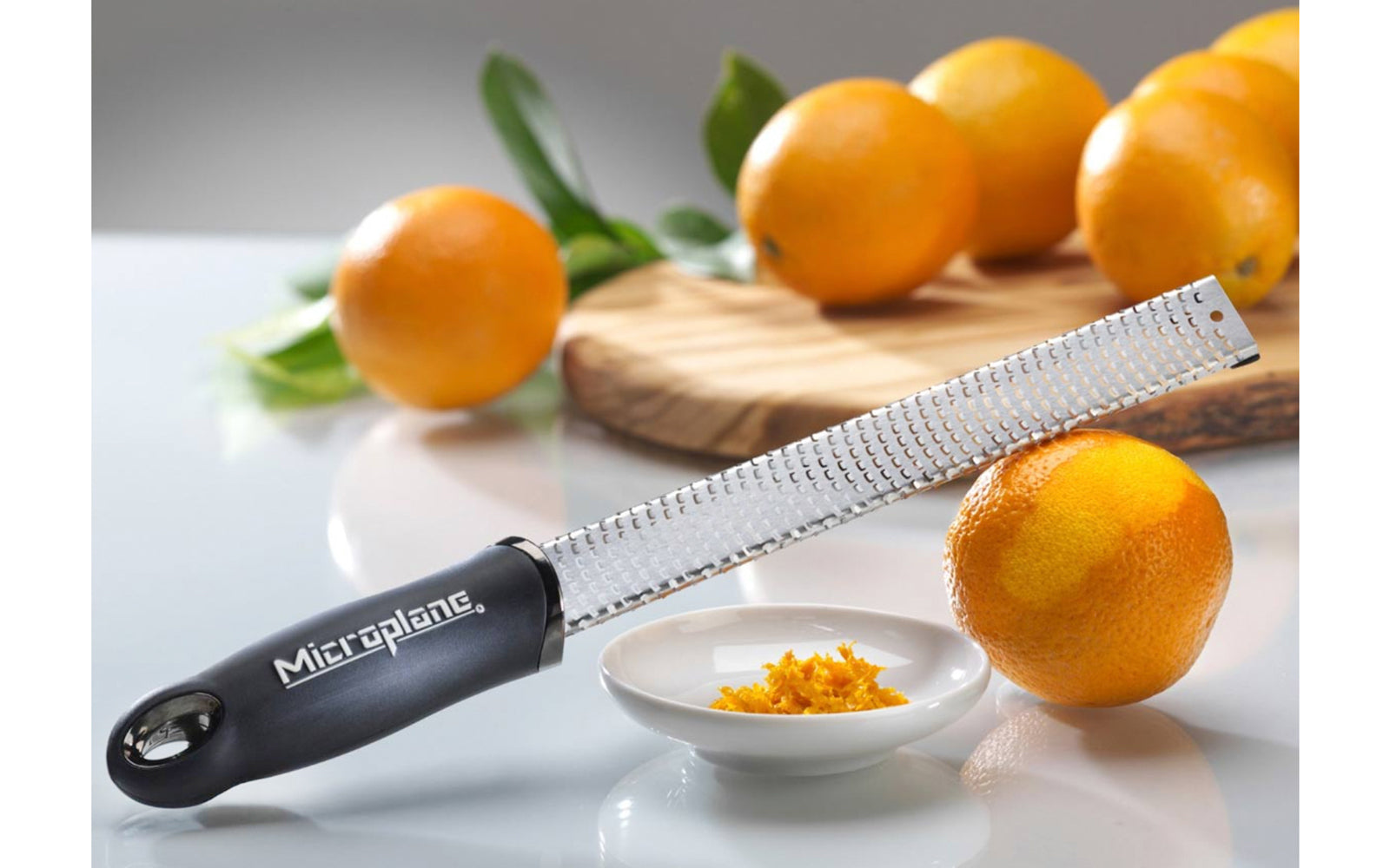 Made in USA - Blade made in USA - Great for grating hard cheeses & Citrus - Non-slip grip - Dishwasher safe - Sharp blades made from stainless steel - 18/8 grade - Ergonomic handle ~ No-slip base - Lemon Zester - Lime Zester - Microplane Fine Zester - Fine Grating - Microplane Premium Zester - Parmesan Reggiano Grater - Model 46020