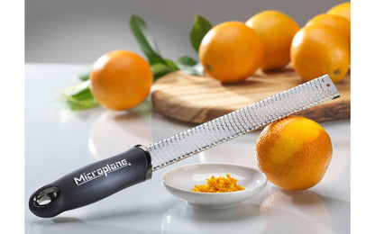 Made in USA - Blade made in USA - Great for grating hard cheeses & Citrus - Non-slip grip - Dishwasher safe - Sharp blades made from stainless steel - 18/8 grade - Ergonomic handle ~ No-slip base - Lemon Zester - Lime Zester - Microplane Fine Zester - Fine Grating - Microplane Premium Zester - Parmesan Reggiano Grater - Model 46020