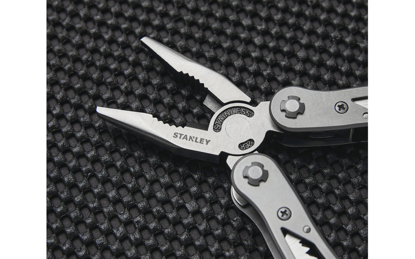 Stanley 12-in-1 Multi-Tool has stainless-steel construction with nylon holster. Includes long nose pliers, curve jaw pliers, wire cutter, saw, Phillips screwdriver, standard 1/4", 5/16", 1/8" screwdrivers, file, small knife, large knife, can opener, & bottle opener. Multi-purpose tool for everyday use. Model No. 84-519