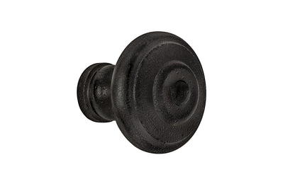 Satin Black Mid-Century Style Cast Iron Knob. Designed in the Mid-Century Style of hardware, but the knob will fit with any time period up to the current modern styles. Made of cast iron material. The knob works well in kitchens, bathrooms, on furniture, cabinets, drawer. 1-3/16" diameter size knob.