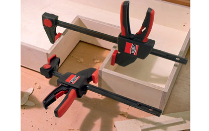 Bessey 6" One-Handed Clamp ~ EZS 15-8. 6" max opening - 3-1/2" throat depth. Intelligent release mechanism on clamp, the upper section can quickly convert from clamping to spreading without tools. Soft pads. 445 lbs. clamping force. Well balanced, ergonomic design for easy, single-handed use. 788502200219