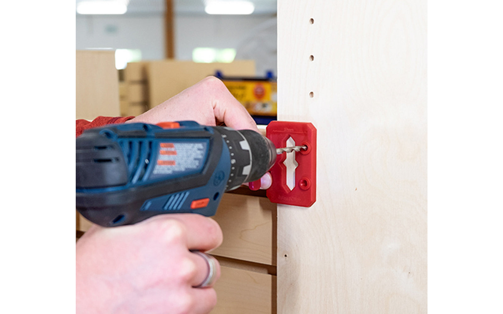 The FastCap Hinge Jig locates the centerline for a hinge. It mounts easily into the 5mm holes & using the cursor to draw a centerline. If cabinets don’t have a 5mm holes, use pins & align them along the edge of the cabinet, drill with 5mm driver bit in the drill guides. For Euro style cabinets & finding hinge's center