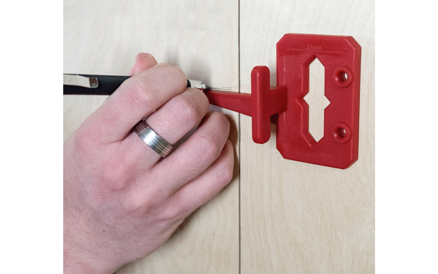 The FastCap Hinge Jig locates the centerline for a hinge. It mounts easily into the 5mm holes & using the cursor to draw a centerline. If cabinets don’t have a 5mm holes, use pins & align them along the edge of the cabinet, drill with 5mm driver bit in the drill guides. For Euro style cabinets & finding hinge's center