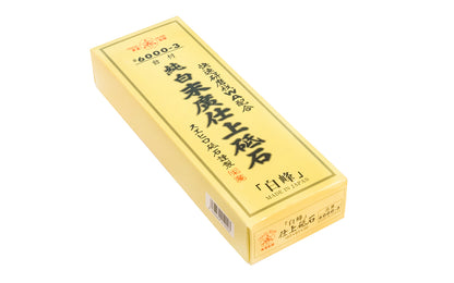 Japanese Suehiro "Shiramine" Finishing Waterstone 6000 Grit is for sharpening carving tools, knives, planes, & kitchen knives. Good finish stone puts a mirror finish on tools. Since the whetstone was fired at high temperature, its quality will not change at ordinary temperatures. Includes stand & small Nagura stone. Suehiro Model No. 6000-3. 4966684019003