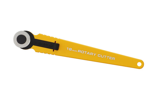 Olfa "RTY-4" Rotary Cutter. 091511600469. Olfa Model RTY-4. 9657. Made in Japan. 18 mm Blade Rotary Cutter - Cuts cloth, paper, film, photographs, & more - Cuts straight or curved lines. Integrated finger grooves. Precision & sharpness navigate tight corners & miniature work. Stainless 18 mm round blade