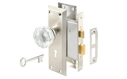 Satin Nickel Finish Mortise Lockset with Glass Knobs. Privacy mortise lockset & skeleton keys with a satin nickel finish on steel material & glass knobs. Includes lock body, two knobs, threaded spindle, two escutcheon trim plates, strike, screws, & two skeleton keys. Model E 28335.