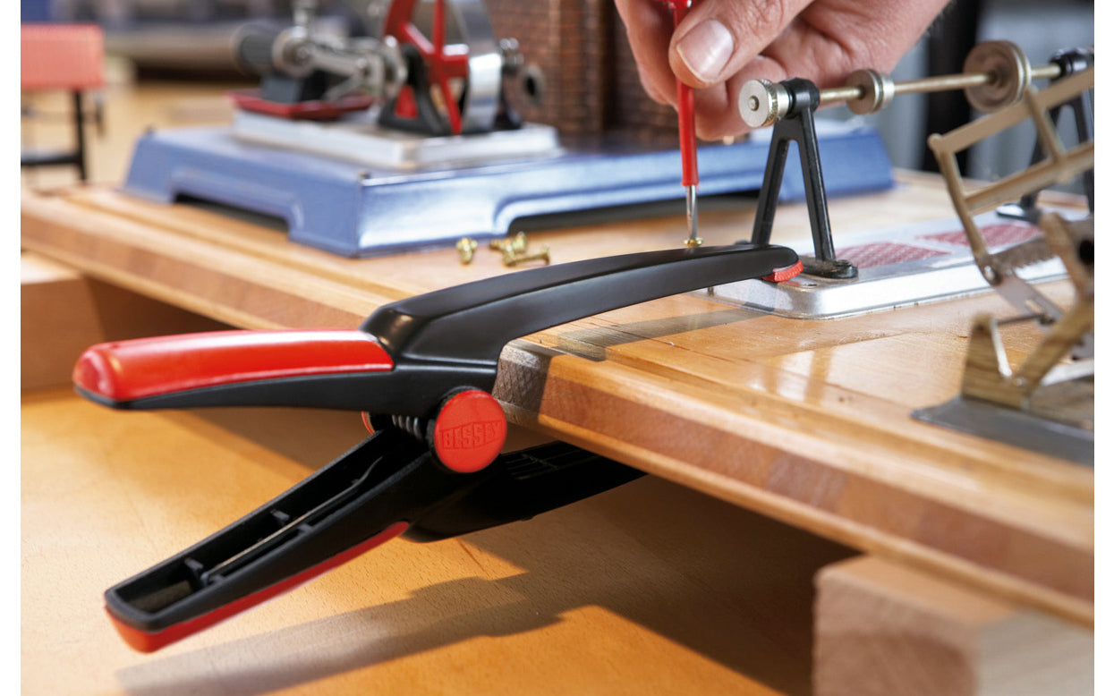 Bessey Clamps Model No. XV5-100 - These Long tapered nose spring clamp from Bessey have a tapered nose & can get into hard-to-reach areas. They have soft-touch pads that prevent marring of delicate work. 3" max opening & 4" clamp depth. Made of plastic material with a soft cushion grip - Long Needle Nose Clamps 