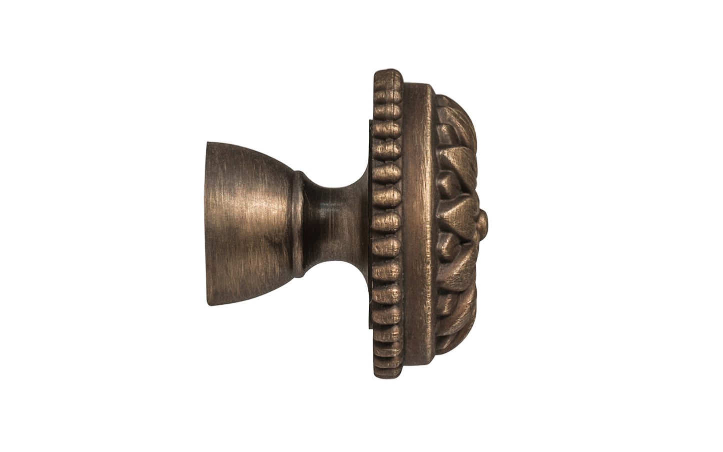 Traditional & classic "French Style" cabinet knob with an elegant flower design & beaded trim. Made of high quality solid brass, his knob has a weighty & durable feel. Great for cabinets, furniture & drawers. The knob is designed in the Late 19th Century style of hardware. Antique brass finish on solid brass material. Available in 1-1/8" diameter & 1-1/2" diameter 
