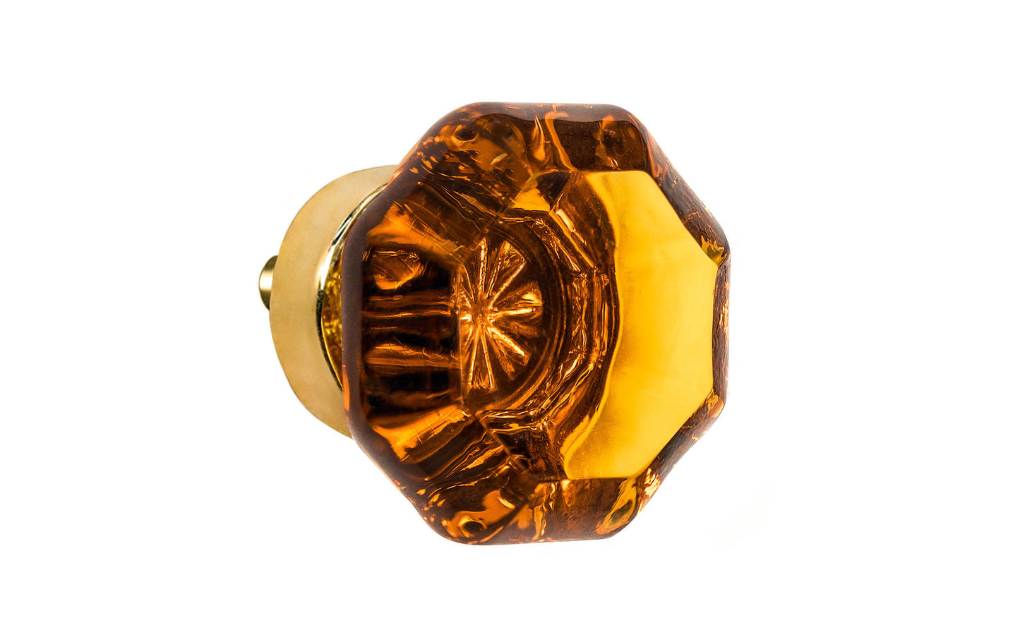 Elegant & classic octagonal cabinet glass knob with an attractive "Amber" color. The glass is carefully set into a handsome solid brass base with a threaded shank in the back. Unlacquered solid brass base (will patina over time). Un-lacquered Brass. Octagon shape knob. 1-1/4" Diameter Knob