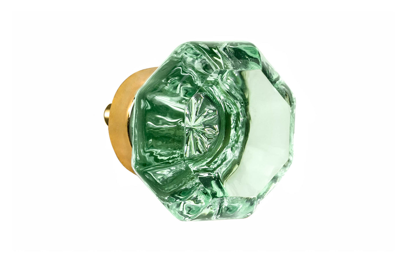 Elegant & classic octagonal cabinet glass knob with an attractive "Depression Green" color. The glass is carefully set into a handsome solid brass base with a threaded shank in the back. Unlacquered brass base - Will patina naturally over time. Octagon shape knob. 1-1/4" Diameter Knob 
