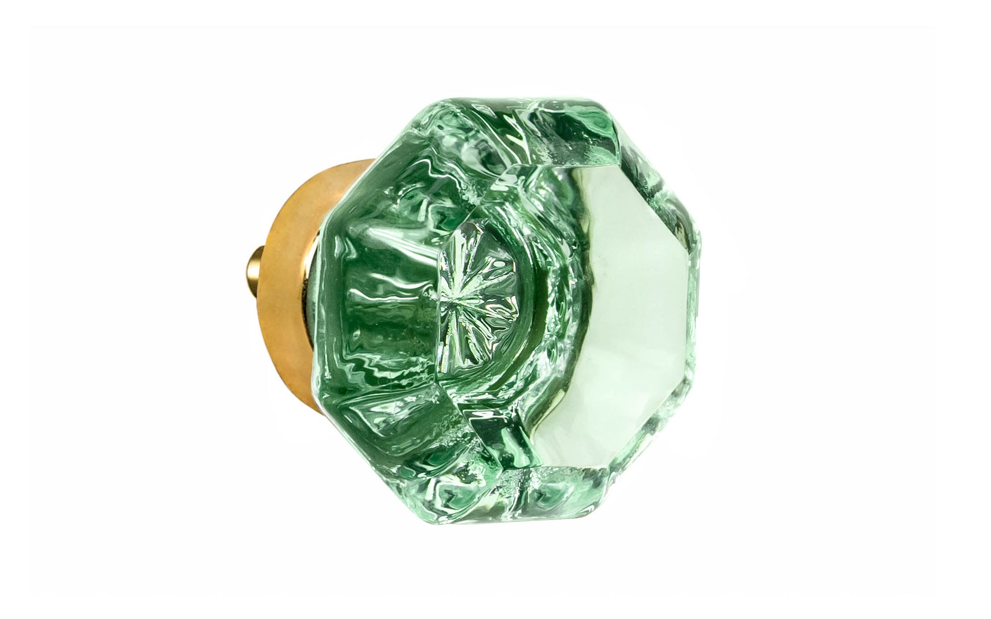 Elegant & classic octagonal cabinet glass knob with an attractive "Depression Green" color. The glass is carefully set into a handsome solid brass base with a threaded shank in the back. Unlacquered brass base - Will patina naturally over time. Octagon shape knob. 1-1/4" Diameter Knob 