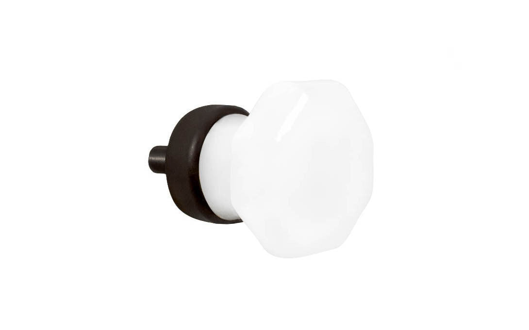 Elegant & classic octagonal cabinet glass knob with an attractive "Translucent White Opal" color. The glass is carefully set into a handsome solid brass base with a threaded shank in the back. Oil Rubbed Bronze finish on solid brass material. Octagon shape knob. 1" Diameter Knob 