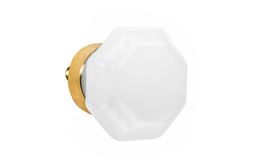 Elegant & classic octagonal cabinet glass knob with an attractive "Translucent White Opal" color. The glass is carefully set into a handsome solid brass base with a threaded shank in the back. Unlacquered brass base - Will patina naturally over time. Octagon shape knob. 1-1/4" Diameter Knob 