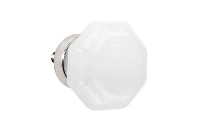 Elegant & classic octagonal cabinet glass knob with an attractive "Translucent White Opal" color. The glass is carefully set into a handsome solid brass base with a threaded shank in the back. Polished nickel finish on solid brass material. Octagon shape knob. 1-1/4" diameter knob.