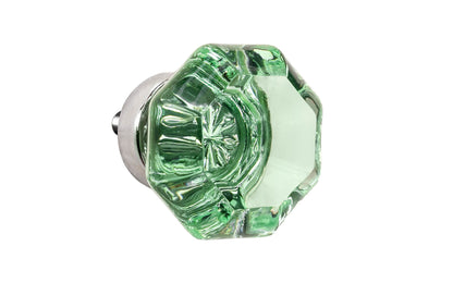 Elegant & classic octagonal cabinet glass knob with an attractive "Depression Green" color. The glass is carefully set into a handsome solid brass base with a threaded shank in the back. Polished nickel finish on solid brass base. Octagon shape knob.  1-1/4" Diameter Knob 