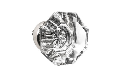 Elegant & classic octagonal cabinet glass knob with attractive genuine clear glass. The glass is carefully set into a handsome solid brass base with a threaded shank in the back. Polished nickel finish on solid brass base. Octagon shape knob. 1-1/4" Diameter Knob 